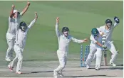  ??  ?? New Zealand players celebrate a Pakistan wicket during the fourth day of first Test. — AP