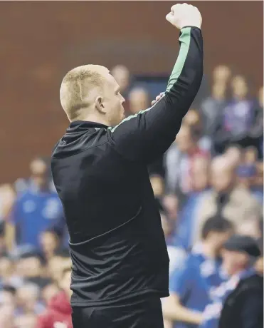  ??  ?? 0 Hibs manager Neil Lennon gestures at the Rangers supporters after his side equalised at Ibrox.