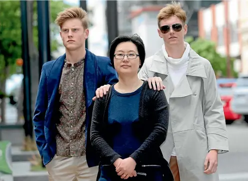  ?? KAVINDA HERATH/STUFF ?? Models Brayden Ward, left, and Hayden Douglas, right, with Southern Institute of Technology Fashion graduate Xiao Ping Jones [Sarah] ahead of the Pheonix fashion showcase tonight.