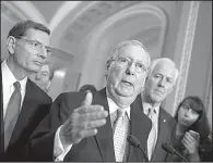  ?? AP/J. SCOTT APPLEWHITE ?? Senate Majority Leader Mitch McConnell, R-Ky., flanked by Republican Sens. John Barrasso (left) of Wyoming and Majority Whip John Cornyn of Texas, speaks Tuesday at the Capitol in Washington.