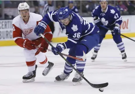  ?? JOHN E. SOKOLOWSKI/USA TODAY SPORTS ?? Leafs defenceman Scott Harrington controls the puck against Detroit’s Anthony Mantha during pre-season pay Saturday night at the ACC.