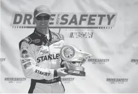  ?? JARED C. TILTON/GETTY IMAGES ?? Carl Edwards is awarded the Sonoma Raceway Drive For Safety Pole Day Award after qualifying for the NASCAR Sprint Cup Series Toyota/Save Mart 350 at Sonoma Raceway.