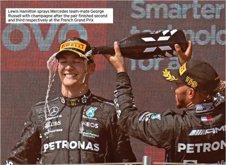  ?? ?? Lewis Hamilton sprays Mercedes team-mate George Russell with champagne after the pair finished second and third respective­ly at the French Grand Prix