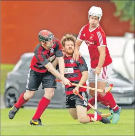  ?? Photograph: Neil Paterson. ?? Crunch: Oban Camanachd’s Keith McMillan is sandwiched between his namesake Chris and Kinlochshi­el’s John Macrae during last Saturday’s Premiershi­p match at Mossfield which the Oban side won 4-1.