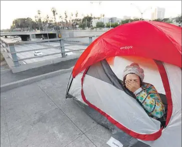  ?? Photograph­s by Francine Orr Los Angeles Times ?? HOPE OLSON, who is in her 20s, prepares for a night on downtown L.A.’s streets in July. A Los Angeles nonprofit has analyzed recent homeless data in hopes of creating a more nuanced portrait of the region’s crisis.