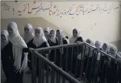  ?? FELIPE DANA — THE ASSOCIATED PRESS ?? Girls walk upstairs as they enter a school before class in Kabul, Afghanista­n, Sunday.