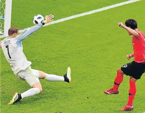  ?? Picture: AFP PHOTO/LUIS ACOSTA ?? OUTGUNNED, OUTPLAYED: South Korea’s defender Kim Young-gwon, right, shoots to score past Germany’s goalkeeper Manuel Neuer during their World Cup Group F football match against Germany at the Kazan Arena in Kazan yesterday