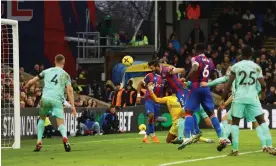  ?? Photograph: Hannah McKay/Reuters ?? James Tomkins scores for Crystal Palace against Brighton after Robert Sánchez had spilled the ball.