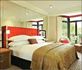  ??  ?? Wake up to a bay window view of Green Park in a bright, chic bedroom