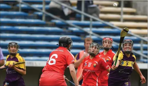  ??  ?? Shelley Kehoe of Wexford attempts to gather possession as Cork centre-back Gemma O’Connor prepares to pounce.