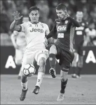  ?? CIRO DE LUCA / REUTERS ?? Paulo Dybala (left) of Juventus and Napoli’s Jorginho battle for possession during Saturday’s Serie A match at Stadio San Paolo, Naples, on Saturday. Juve won 1-0.