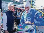  ?? Darron Cummings/Associated Press ?? Josef Newgarden, right, was cleared to race Saturday after collapsing Sunday in Iowa.