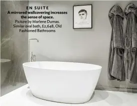  ??  ?? EN SUITE
A mirrored wallcoveri­ng increases the sense of space. Picture by Marlene Dumas. Similar oval bath, £2,648, Old Fashioned Bathrooms