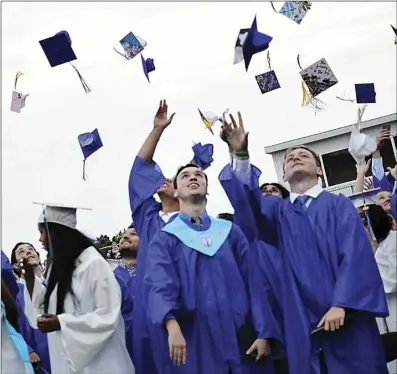  ?? Photo by Ernest A. Brown ?? Local high schools returned to in-person graduation­s in 2021.