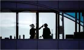  ??  ?? Healthcare at a hospital in Duluth, Minneapoli­s, take the temperatur­e of every visitor. Photograph: Alex Kormann/Star Tribune via Getty Images