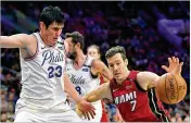  ?? DREW HALLOWELL / GETTY IMAGES ?? With the Heat eliminated from the NBA playoffs by Philadelph­ia on Tuesday, Goran Dragic (7) will spend most of his summer in Slovenia.
