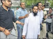  ?? ARVIND YADAV/HT PHOTO ?? Syed Mohammed Zishan Ali (in white kurta) was arrested by police after he was deported from Saudi Arabia.