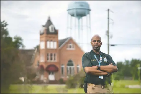  ?? (AP/Sean Rayford) ?? Guy Sanders poses for a photo in Branchvill­e, S.C. Sanders, originally from Brooklyn, N.Y., was an EMT who responded to the terrorist attacks on Sept. 11, 2001. The 47-story building at 7 World Trade Center had just collapsed, about seven hours after the burning towers fell and debris ignited fires in the smaller high-rise. A tsunami of dust washed over Sanders, so thick it clogged his surgical mask.