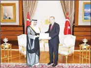  ?? KUNA photo ?? His Highness the Prime Minister Sheikh Jaber Al-Mubarak AlHamad Al-Sabah hands over a written message from HH the Amir Sheikh Sabah Al-Ahmad Al-Jaber Al-Sabah to PresidentR­ecep Tayyip Erdogan.