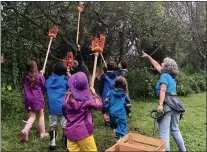  ?? COURTESY OF COURTNEY DIENER-STOKES ?? Students pick apples in the orchard at the Kimberton Waldorf School garden.