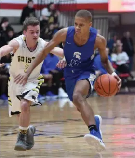  ?? PATRICK HOPKINS — FOR THE NEWS-HERALD ?? Richmond Heights’ Jamarr Talbert drives against Bristol during the Spartans’ victory in Division IV regional semifinal March 12 in Canton.