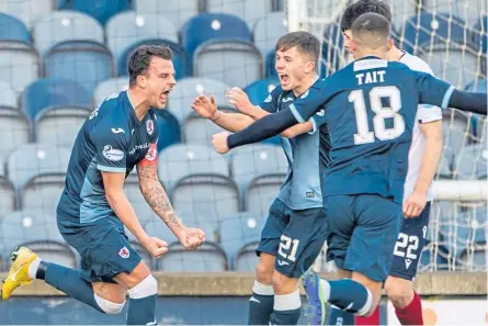  ??  ?? Raith’s Kyle Benedictus (left) celebrates with teammates after making it 1-1