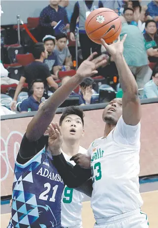  ?? PHOTO BY BOB DUNGO JR. ?? Ben Mbala of La Salle ( right) battles for the ball against Adamson’s Papi Sarr during the UAAP men’s basketball tournament semis at the Mall of Asia Arena. Mbala is seen as the sure winner of the MVP plum this season.