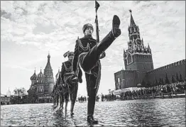  ?? MLADEN ANTONOV/GETTY-AFP ?? 1941 remembered: Russian guardsmen in Moscow on Wednesday mark the anniversar­y when the Red Army paraded past the Kremlin to battle Nazi troops in World War II.