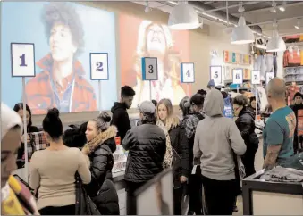  ?? -AP ?? Holiday shoppers take part in early Black Friday shopping deals at the Old Navy store on the Thanksgivi­ng holiday in Times Square in New York City.