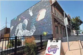  ?? ANGELA PETERSON / MILWAUKEE JOURNAL SENTINEL ?? A new meaning for Milky Way, maybe, in the mural on the side of the Peanut Butter &amp; Jelly Deli in West Allis.