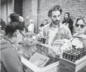  ?? Wally Skalij / Los Angeles Times ?? Customers check out the wares in a medical marijuana shop in Los Angeles. With pot legal in Canada this week, the supply is expected to meet only 30 to 60 percent of demand.