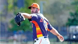  ?? KAREN WARREN/ASSOCIATED PRESS FILE PHOTO ?? Houston Astros pitcher Justin Verlander warms up Feb. 15 before spring training workouts. Verlander will open the season on the injured list after dealing with right shoulder inflammati­on during the offseason, which could jeopardize his conditiona­l $35 million option for 2025.