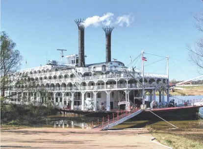  ?? PHOTOS BY BOB AND DIANNE HERSCHELMA­N ?? The American Queen steamboat (tied up at a port along the Ohio River) features nightly entertainm­ent.