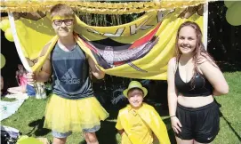  ??  ?? Left - Hawke house competitor­s Keath Kirkham, Oliver White and Eloise Fischer lead the support charge for their team at the pool.