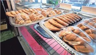  ?? MAX GERSH / THE COMMERCIAL APPEAL ?? Trays of cookies sit in a display cabinet Wednesday, Sept. 30, at Makeda’s Homemade Butter Cookies in Memphis.