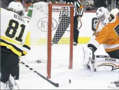  ?? Associated Press ?? Phil Kessel scores his 28th goal of the season, snapping a shot past Flyers goalie Petr Mrazek in the first period.