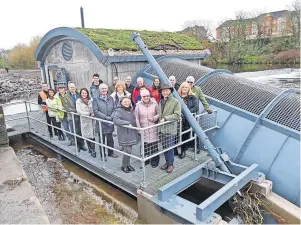  ?? ?? Operationa­l Pictured are some of the guests who viewed the official opening of the Nethermill­s Hyrdo Scheme on the River Ayr on Monday