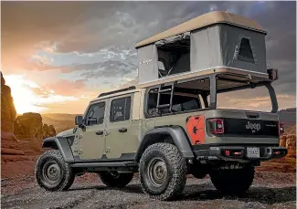  ??  ?? Home away from home: the Wayout features a custom canopy and a rooftop tent.