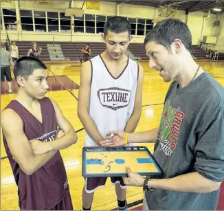  ?? RALPH BARRERA / AMERICAN-STATESMAN ?? Carlos Espino (left) and Aaron Gutierrez take instructio­n from Texline coach Tanner Martin. The Tornadoes reached the state tournament for the first time in school history.