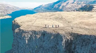  ?? UNCRUISE ADVENTURES/TRIBUNE NEWS SERVICE ?? Hiking on the Rowena Plateau in Oregon is one of the heart-pumping offerings available on a new trip by UnCruise Adventures.