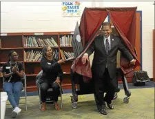  ?? TRENTONIAN FILE PHOTO ?? Trenton mayoral candidate Paul Perez emerges from the voting booth at Joyce Kilmer Middle School Tuesday.