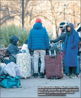  ?? BARRY WILLIAMS FOR NYDN ?? Migrants are pictured in Tompkins Square Park in January. An agreement with the Legal Aid Society allows city to deny migrants shelter in some instances.