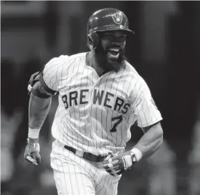  ?? GETTY IMAGES ?? Eric Thames, who was signed by the Milwaukee Brewers in the off-season after playing for three years in the Korean Baseball Organizati­on, socked a franchise-record 11 home runs in April. Although the slugger cooled off, he was still a bright spot for...