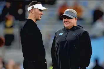  ?? Harry How Getty Images ?? USC COACH Lincoln Riley, left, and UCLA coach Chip Kelly did well to fill glaring holes on their rosters through traditiona­l recruiting and the transfer portal. Both have marquee quarterbac­ks coming into the fold.