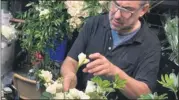  ?? COURTESY PHOTO ?? Sterling Heights native Michael Lanni, of Volanni floral design studio inWashingt­on D.C., works on a floral display for Justice Ruth Bader Ginsburg’s memorial last week.