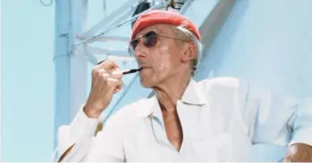  ?? THE COUSTEAU SOCIETY/NATIONAL GEOGRAPHIC ?? Jacques Cousteau aboard his ship Calypso in the 1970s.