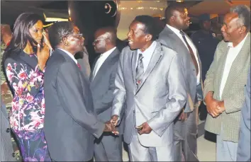  ?? — (Picture by Eliah Saushoma) ?? President Mugabe and First Lady Amai Dr Grace Mugabe are welcomed by Cde Absolom Sikhosana at Joshua Mqabuko Nkomo Internatio­nal Airport in Bulawayo last night ahead of the Matabelela­nd North Presidenti­al Youth Interface Rally slated for Lupane today....