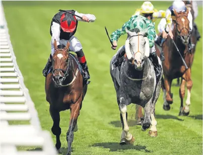  ?? Picture: PA. ?? Free Eagle, left, ridden by Pat Smullen, battles it out with The Grey Gatsby on the way to winning the Prince Of Wales’s Stakes on the second day of the royal meeting.