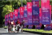  ?? ?? This photo taken on Nov. 13, 2022 shows posters for the 17th Group of 20 (G20) Summit in Bali, Indonesia. (Xinhua/Wang Yiliang)