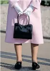  ?? ?? BRITAIN’S Queen Elizabeth with her trademark – a classic quality handbag. | Reuters